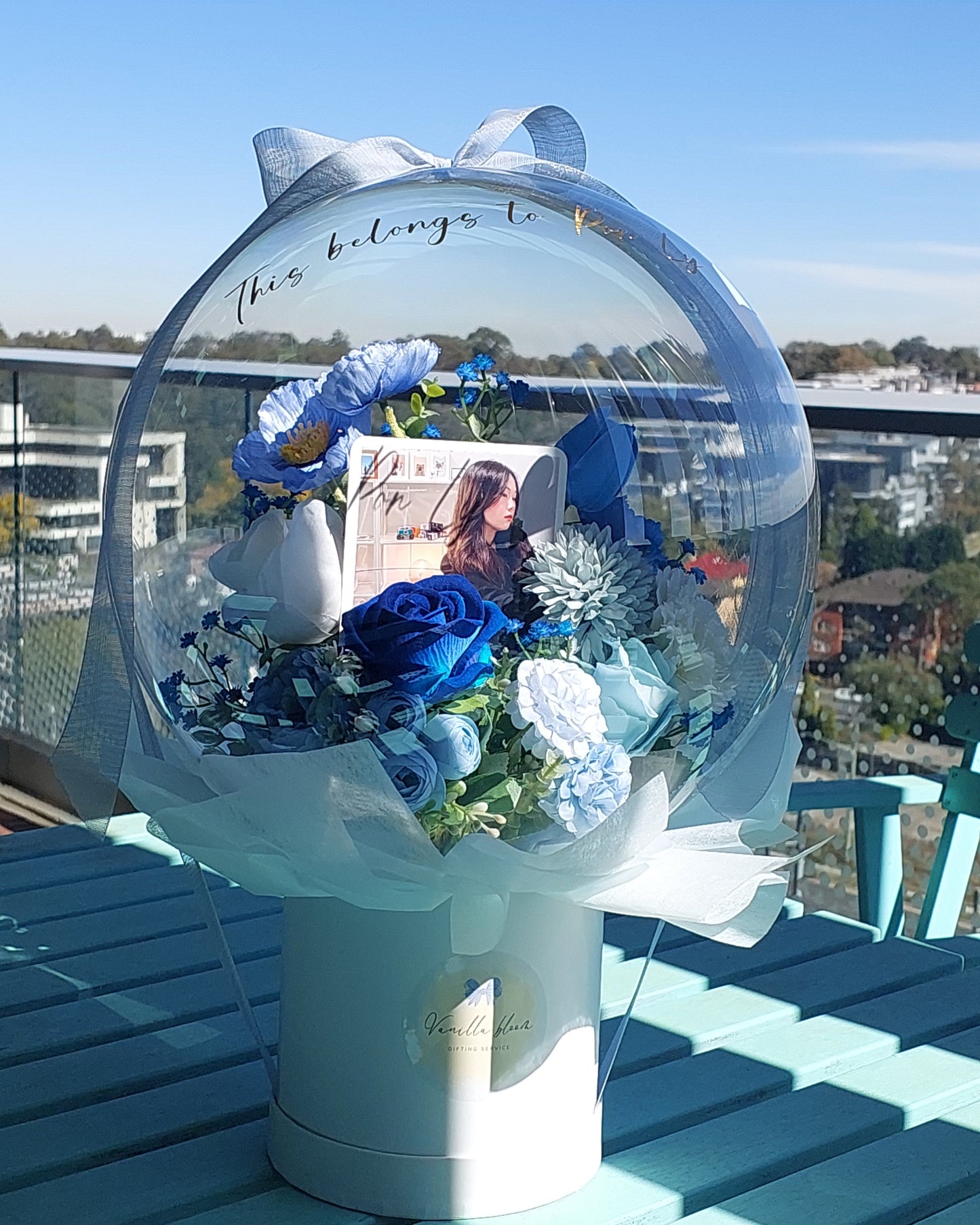 Large Flower Balloon pot with a picture inside. 